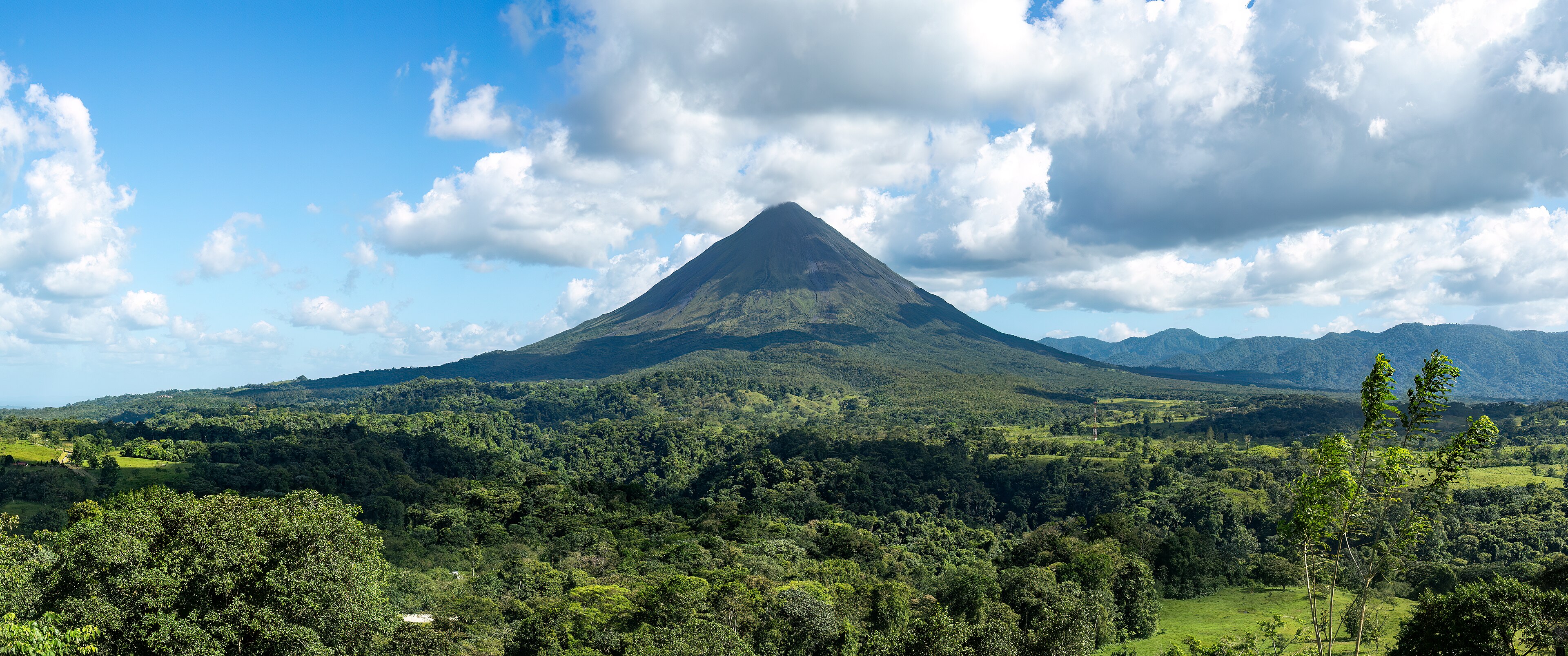 Arenal Volcano's cone above the rainforest near La Fortuna